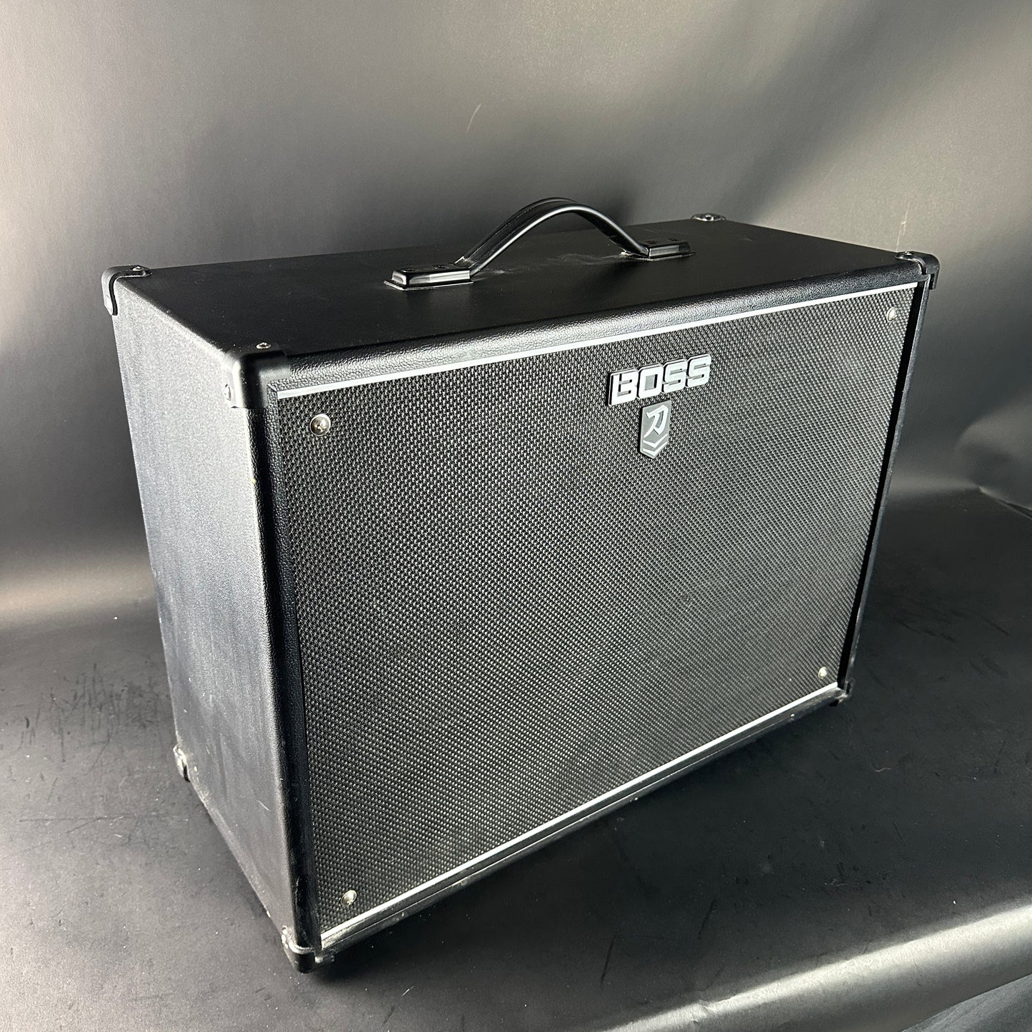 Boss guitar amplifier cabinet on a gray background
