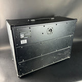 Black rectangular case with metallic accents on a gray background