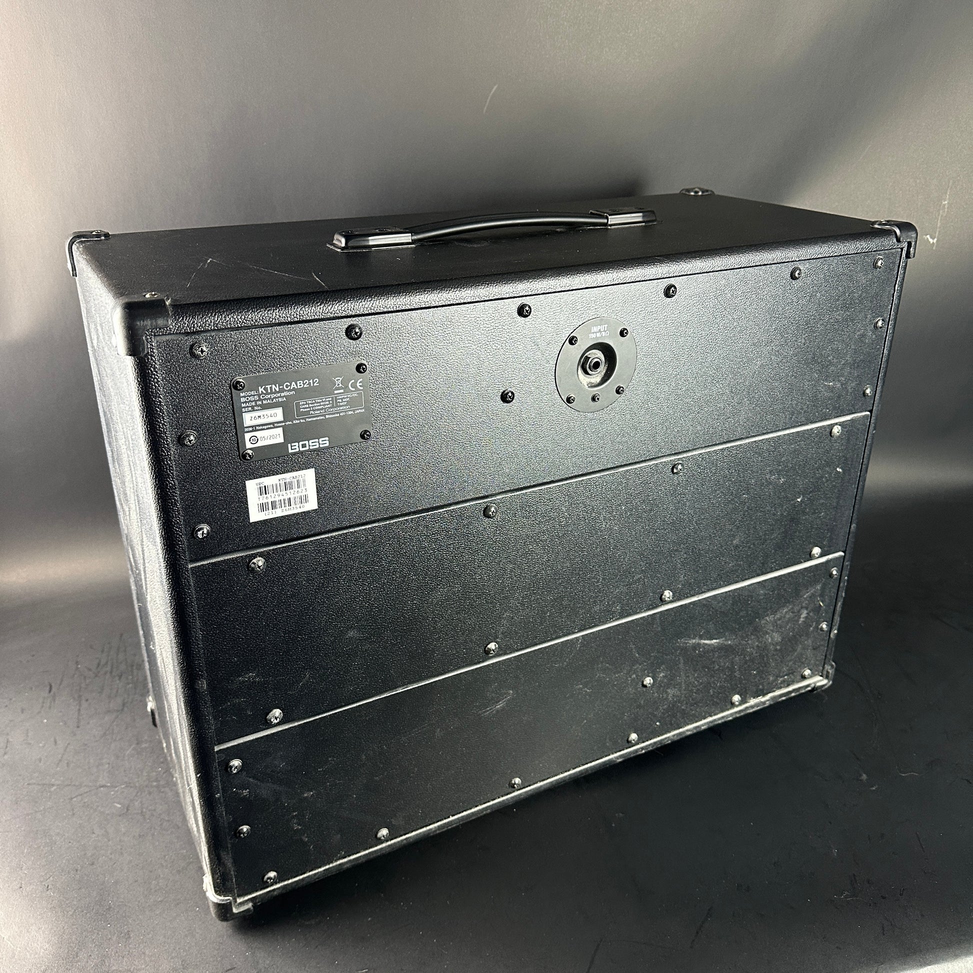 Black rectangular case with metallic accents on a gray background