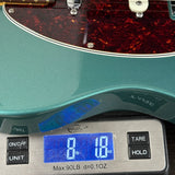 Used 2025 Fender Hot Shot Telecaster Green on scale displaying weight.