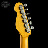 Guitar headstock with tuning pegs on a black background, featuring 'Tone Shop' logo.