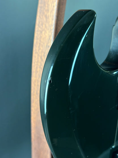 Close-up of a black plastic component on a metallic surface