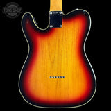 The back of a classic Fender Telecaster electric guitar with a classic sunburst finish, featuring a black pickguard and six silver control screws, shown against a solid black background with a Tone Shop watermark in the top left corner.