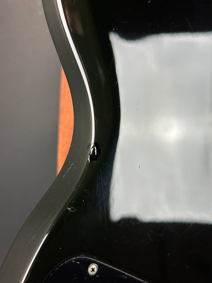 Close-up of a guitar pickguard with a visible screw.