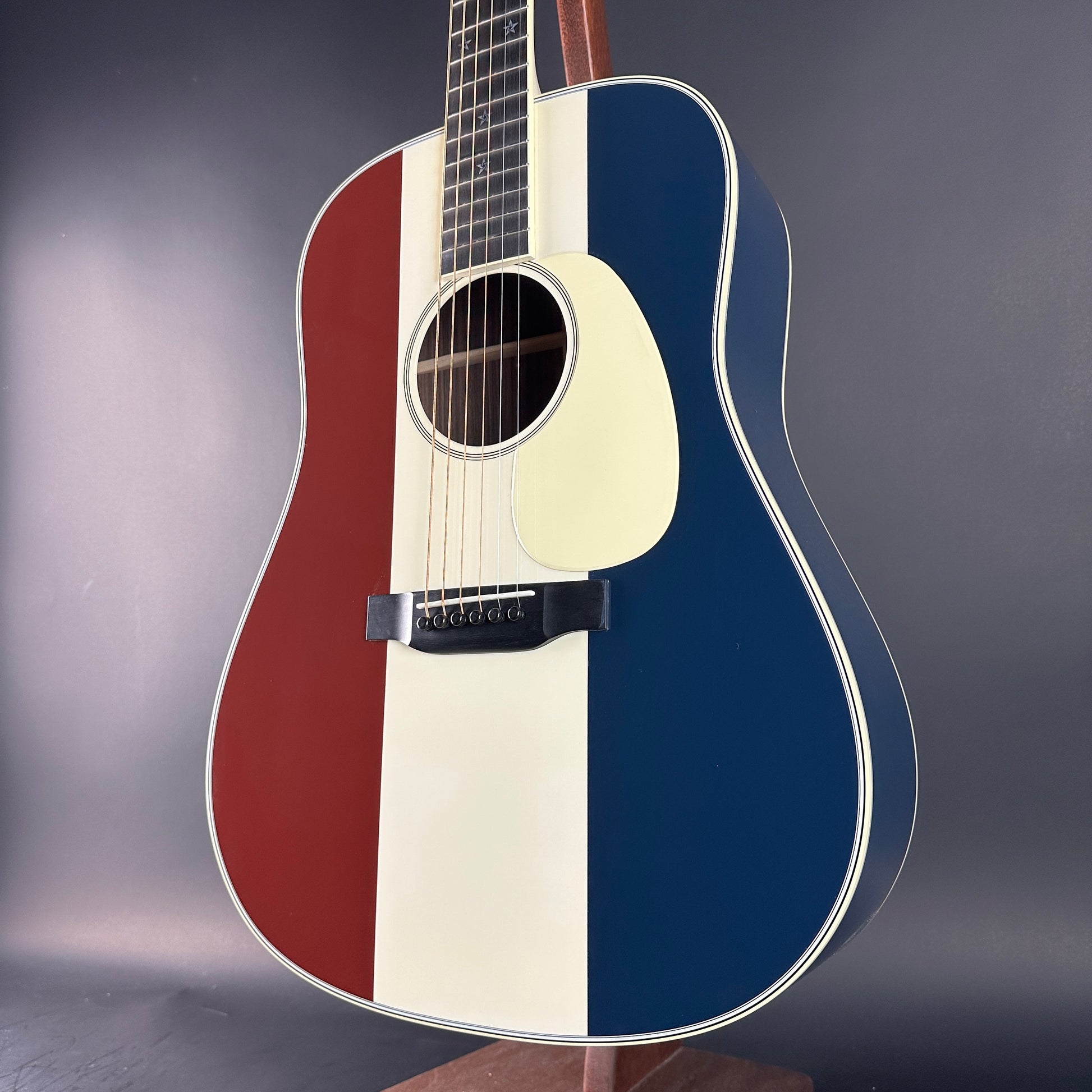 Front angle of Used Martin Custom Shop Dread Red/White/Blue Sitka/EIR.
