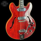Red electric guitar with a black background