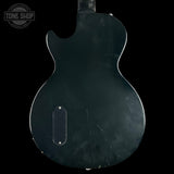 Back view of a guitar with 'Tone Shop' logo in the corner.