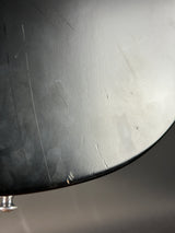 Close-up of a metallic surface with visible texture and reflections