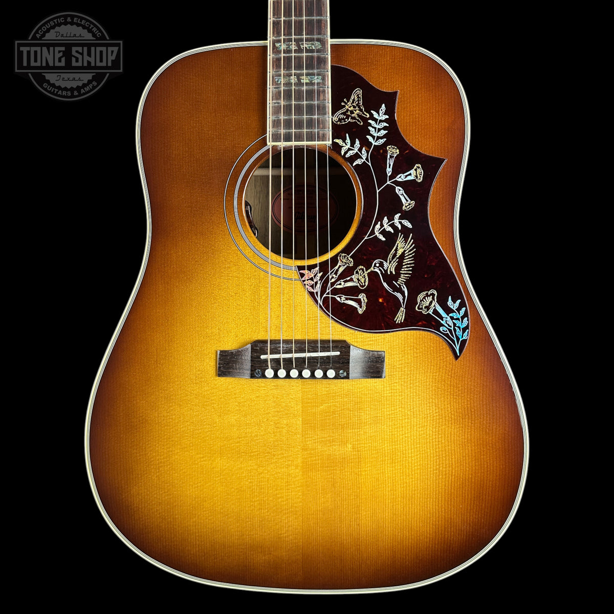 Front of Gibson Hummingbird Elegant Koa Honey Burst.