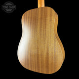Back view of a wooden acoustic guitar with 'Tone Shop' logo in the corner.