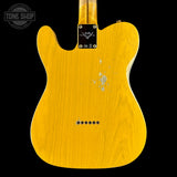 The back of a Fender Telecaster electric guitar with a bright yellow maple wood finish, showing a distressed finish and a black Fender headstock plate, set against a solid black background.