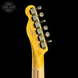 Close-up of the headstock of a Fender electric guitar with a natural yellow maple neck, showing the brand logo and six tuning pegs against a black background.