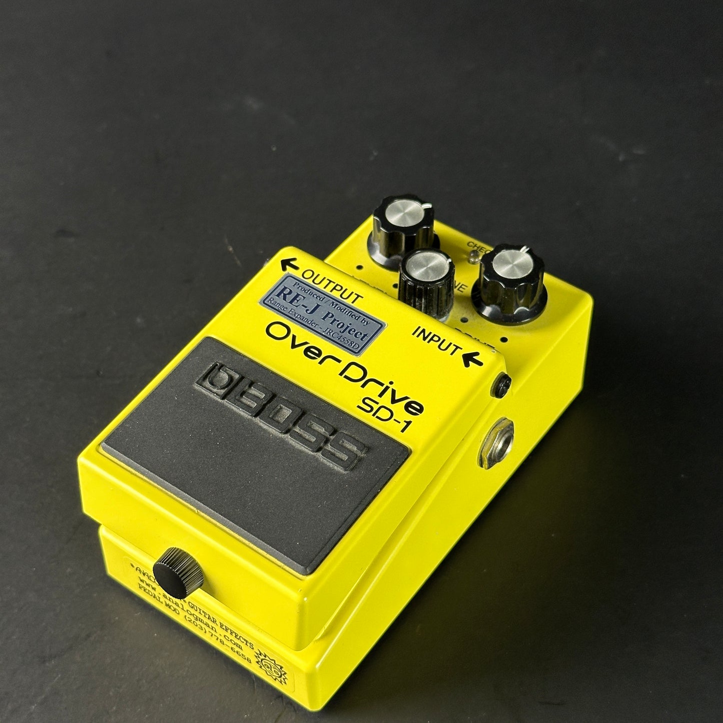 Yellow OverDrive SD-1 guitar effects pedal on a dark background