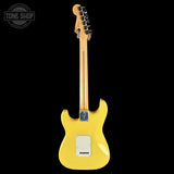 Yellow electric guitar on a black background with 'Tone Shop' logo.