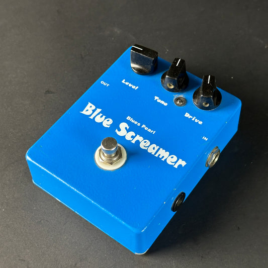 Blue Screamer guitar effects pedal on a dark background