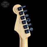 Guitar headstock with tuning pegs on a black background, featuring the Fender logo.