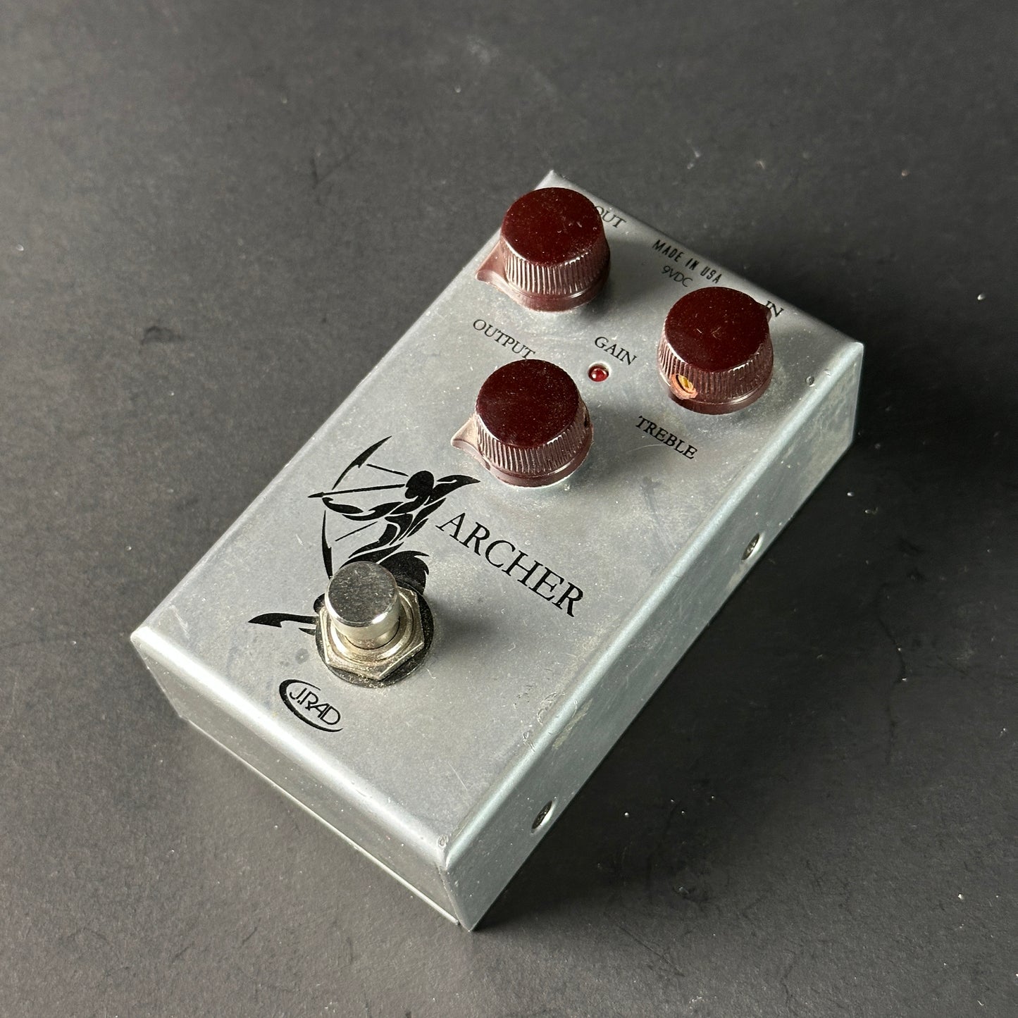 Guitar effects pedal with 'Archer' branding on a dark background