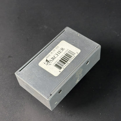 Small rectangular box with a label on a dark background