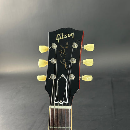 Gibson Les Paul guitar headstock on a dark background