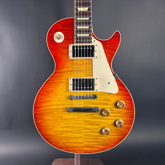 Electric guitar with a sunburst finish on a gray background