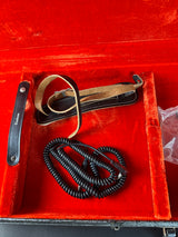 Cable and strap inside the case of Vintage 1974 Fender Mustang 3 Color Sunburst.