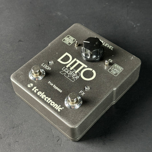 Guitar effects pedal with 'Ditto Looper' branding on a dark surface