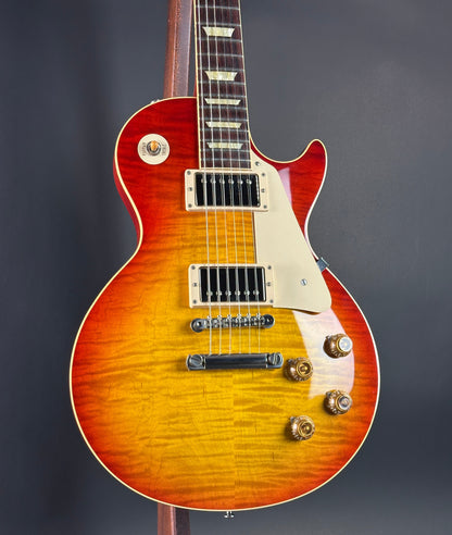 Electric guitar with a sunburst finish on a dark background