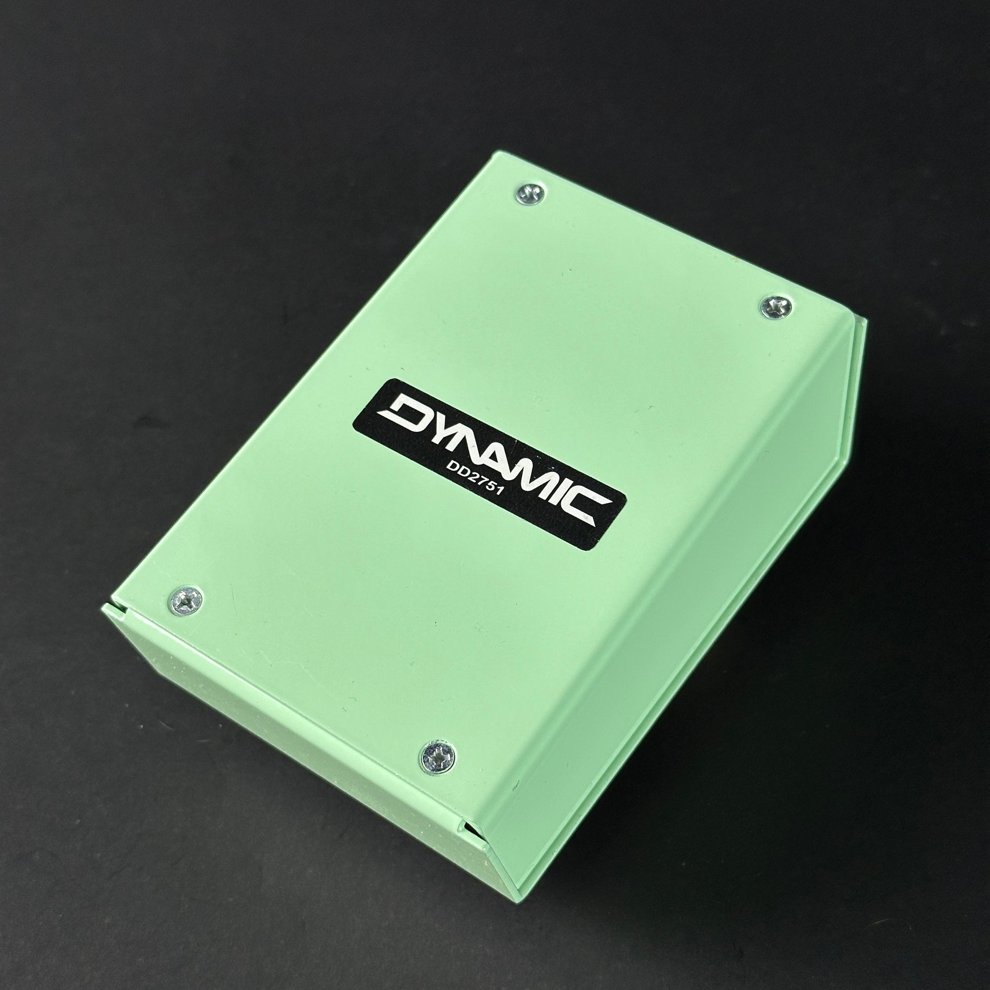 Green electronic device with 'Dynamic' branding on a black background