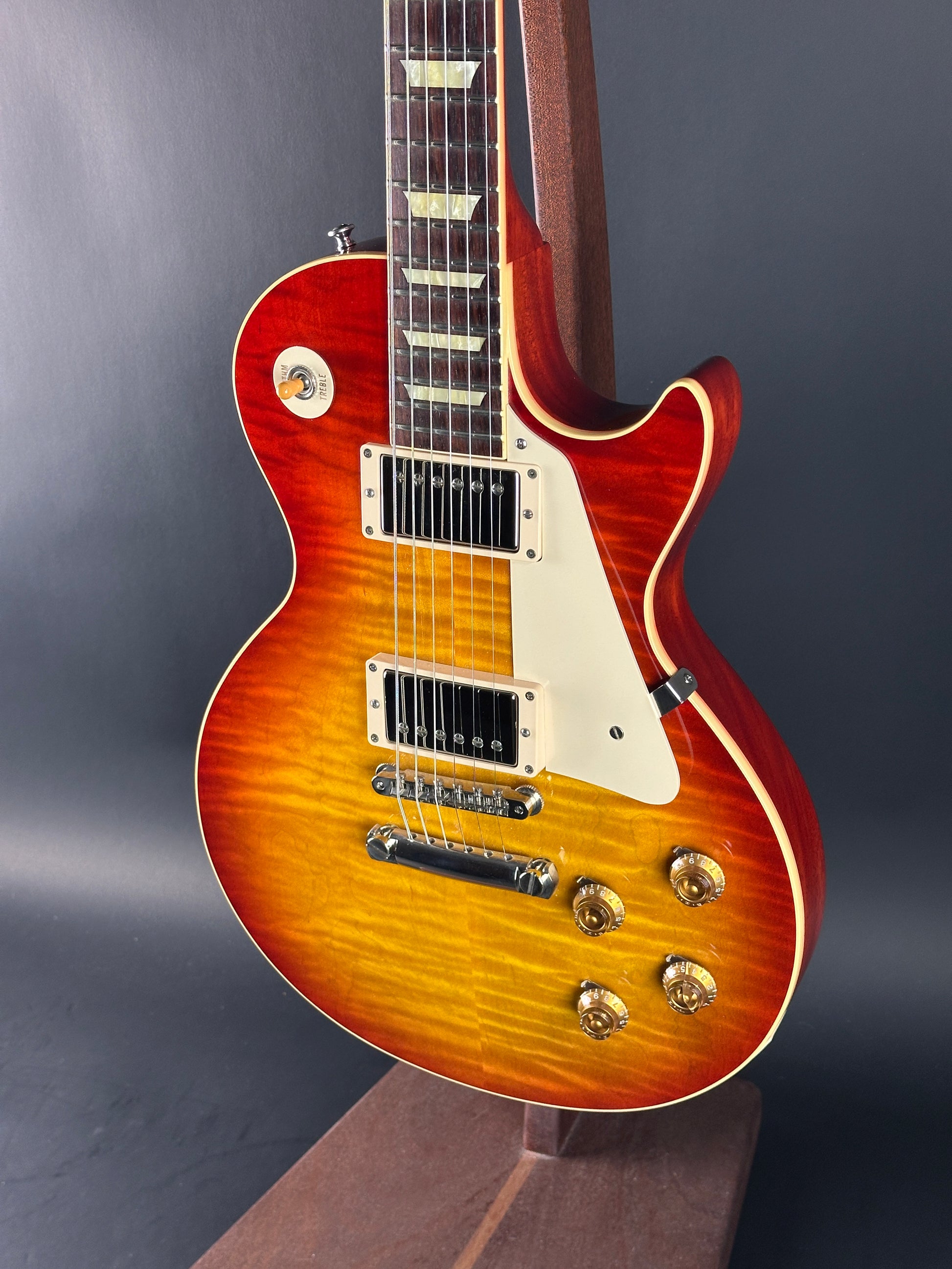 Gibson Les Paul electric guitar with a sunburst finish on a dark background