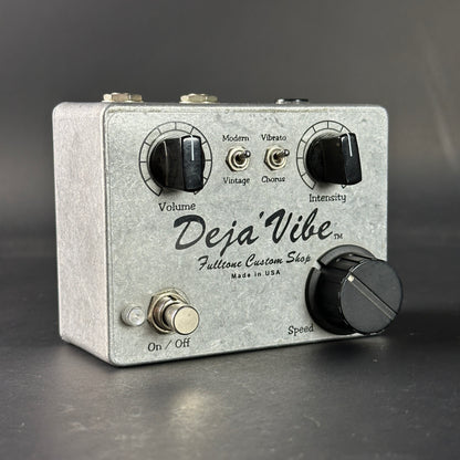 Guitar effects pedal with 'Deja'Vibe' branding on a dark background