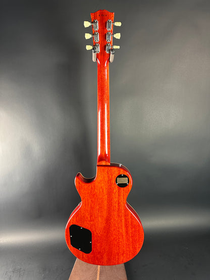 Red electric guitar on a gray background