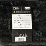 A black fuzzy instrument headstock insert with a hanging product tag fromPRS for Music Guitars. The tag shows product details including model Dat Bridge, serial number 041813, and a signature at the bottom.