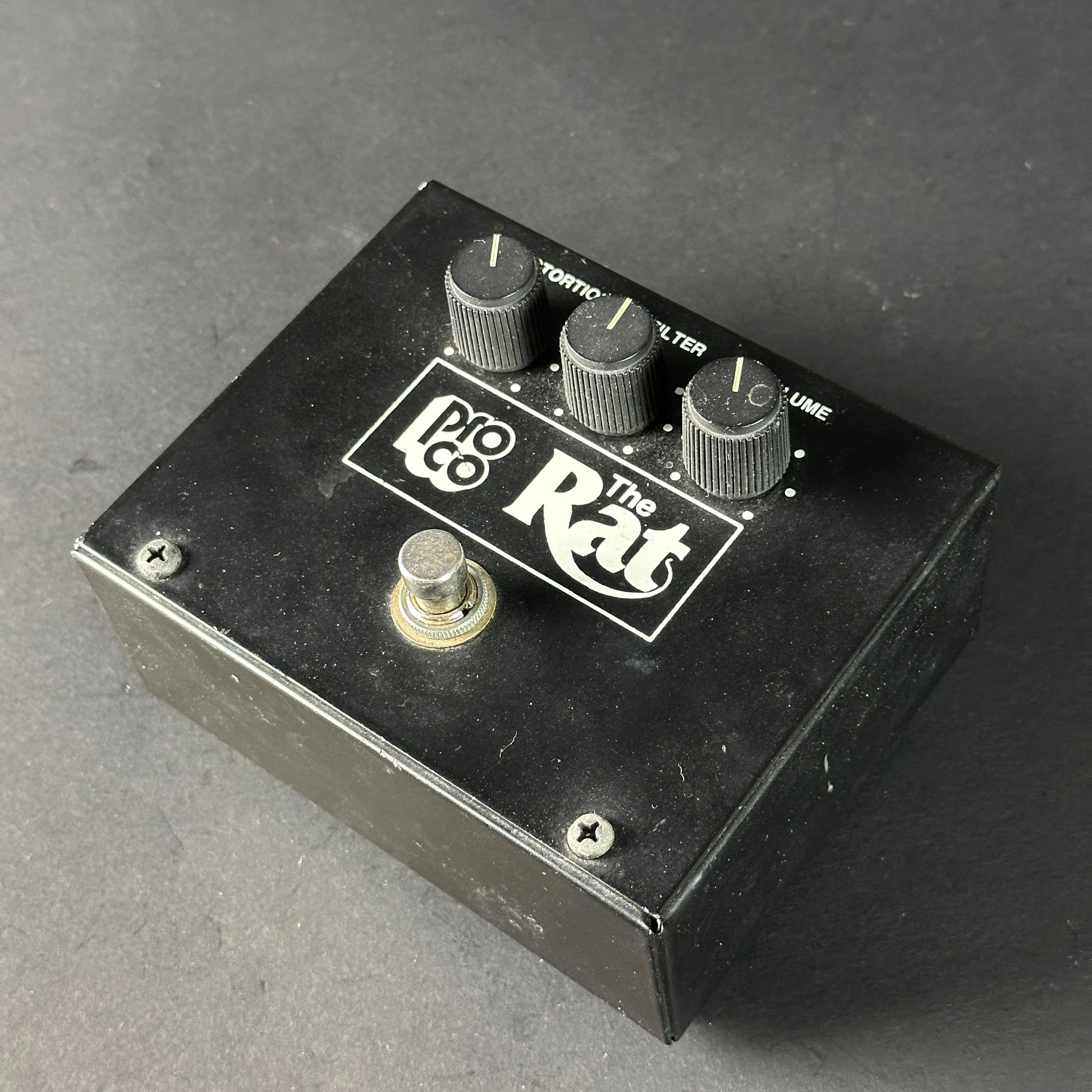 Pro Co The Rat guitar effects pedal on a gray background