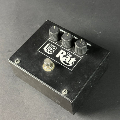Pro Co The Rat guitar effects pedal on a gray background