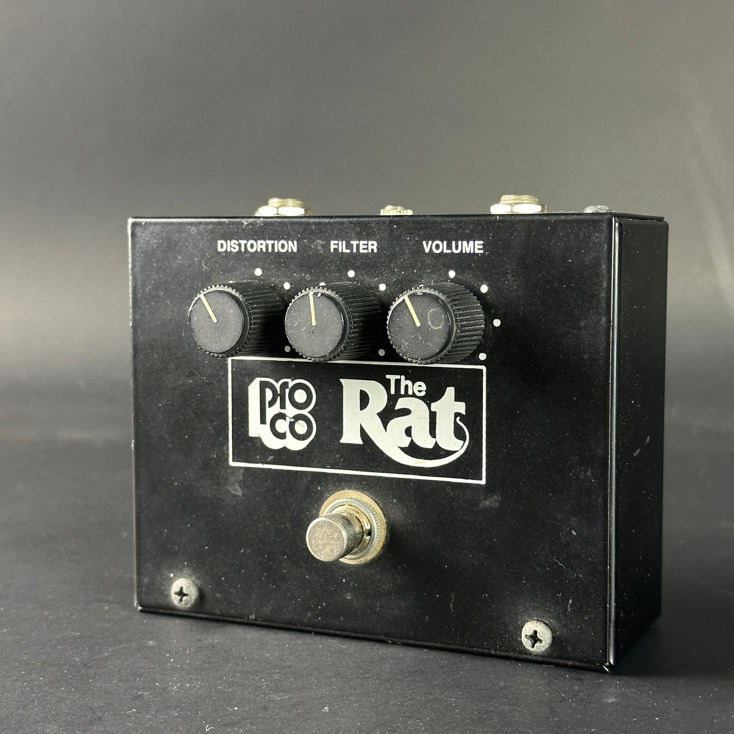 Pro Co The Rat guitar effects pedal on a gray background