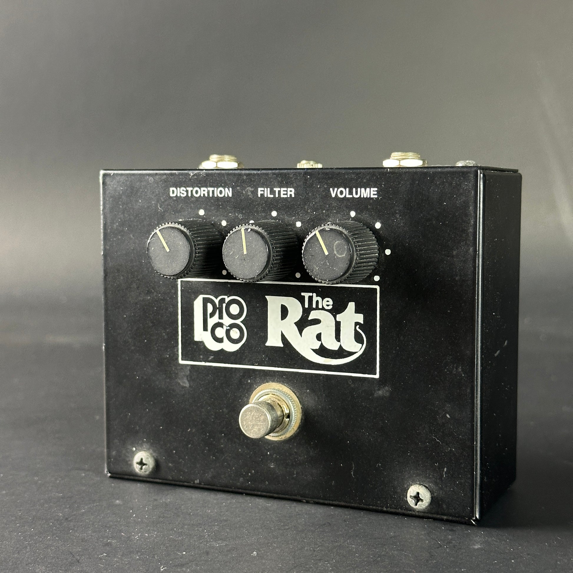 Pro Co The Rat guitar effects pedal on a gray background