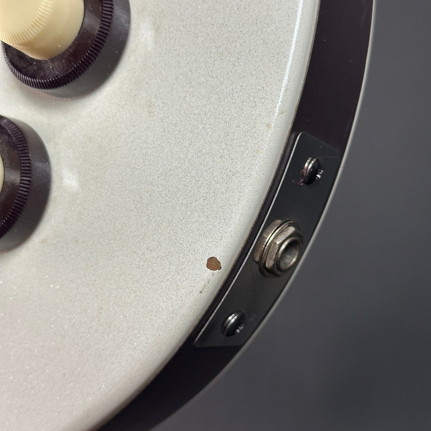 Chip near output jack of Used Danelectro Double Neck 6/12 White.
