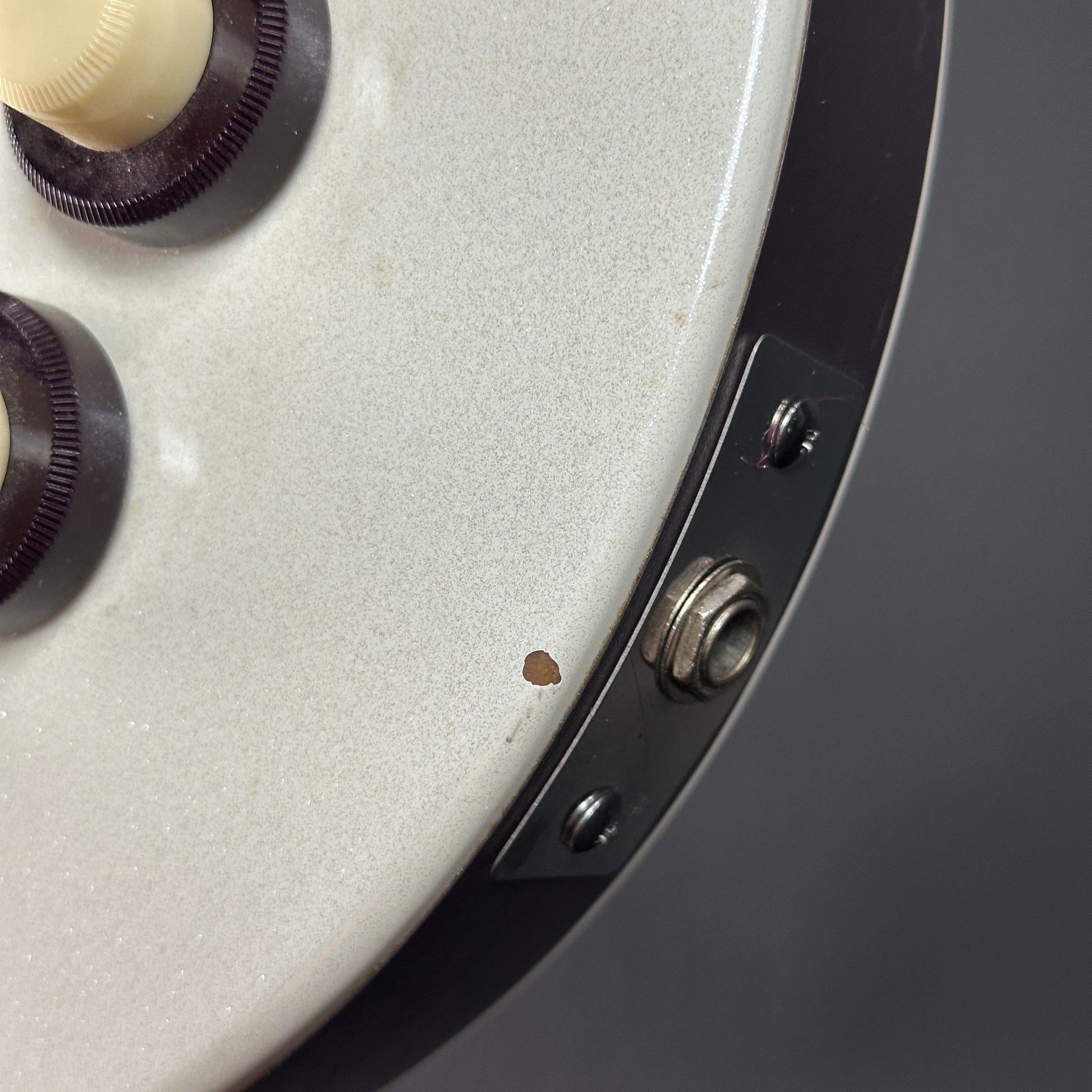 Chip near output jack of Used Danelectro Double Neck 6/12 White.