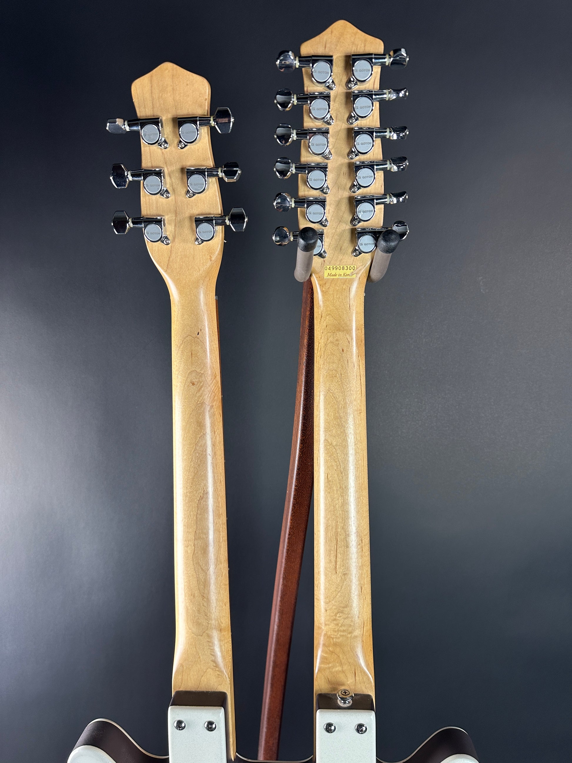 Back of necks of Used Danelectro Double Neck 6/12 White.