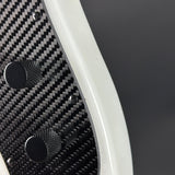 Close-up of a carbon fiber texture with a dark background
