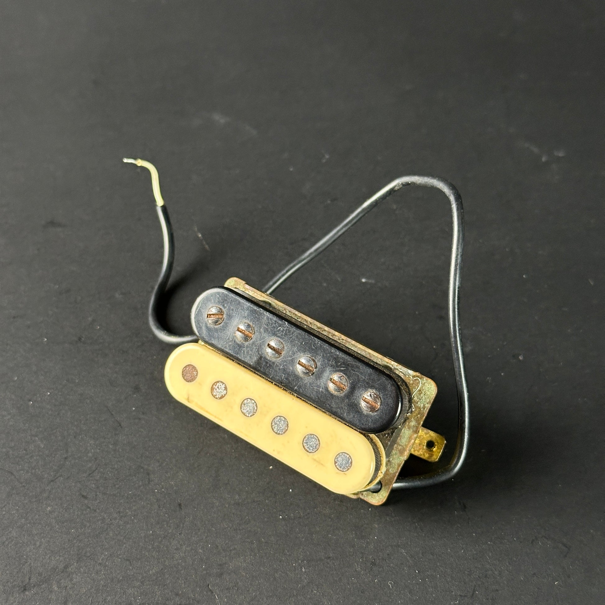 Guitar pickup on a dark gray background