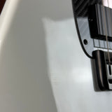 Close-up of a guitar neck and headstock on a white background
