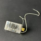 Guitar pickup on a dark gray background