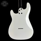 White electric guitar body on a black background with 'Tone Shop' logo.