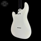 White electric guitar body on a black background with 'Tone Shop' logo.