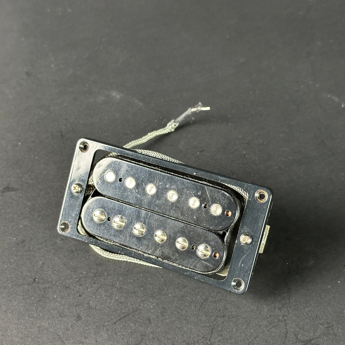 Guitar pickup on a dark gray background