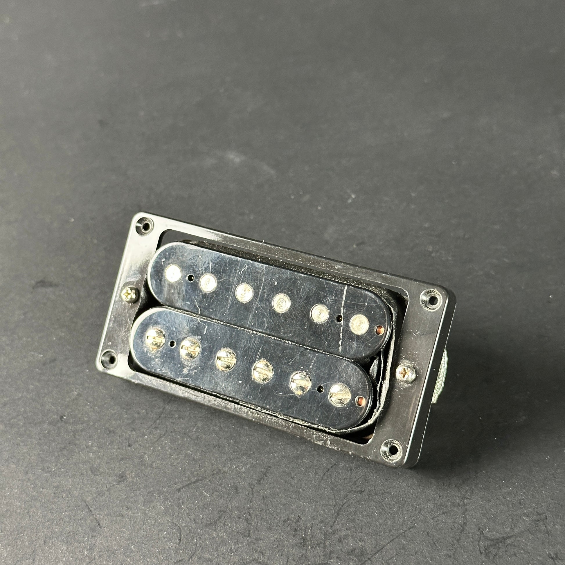 Guitar pickup on a gray background