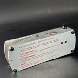 Metalic control panel with text on a dark background