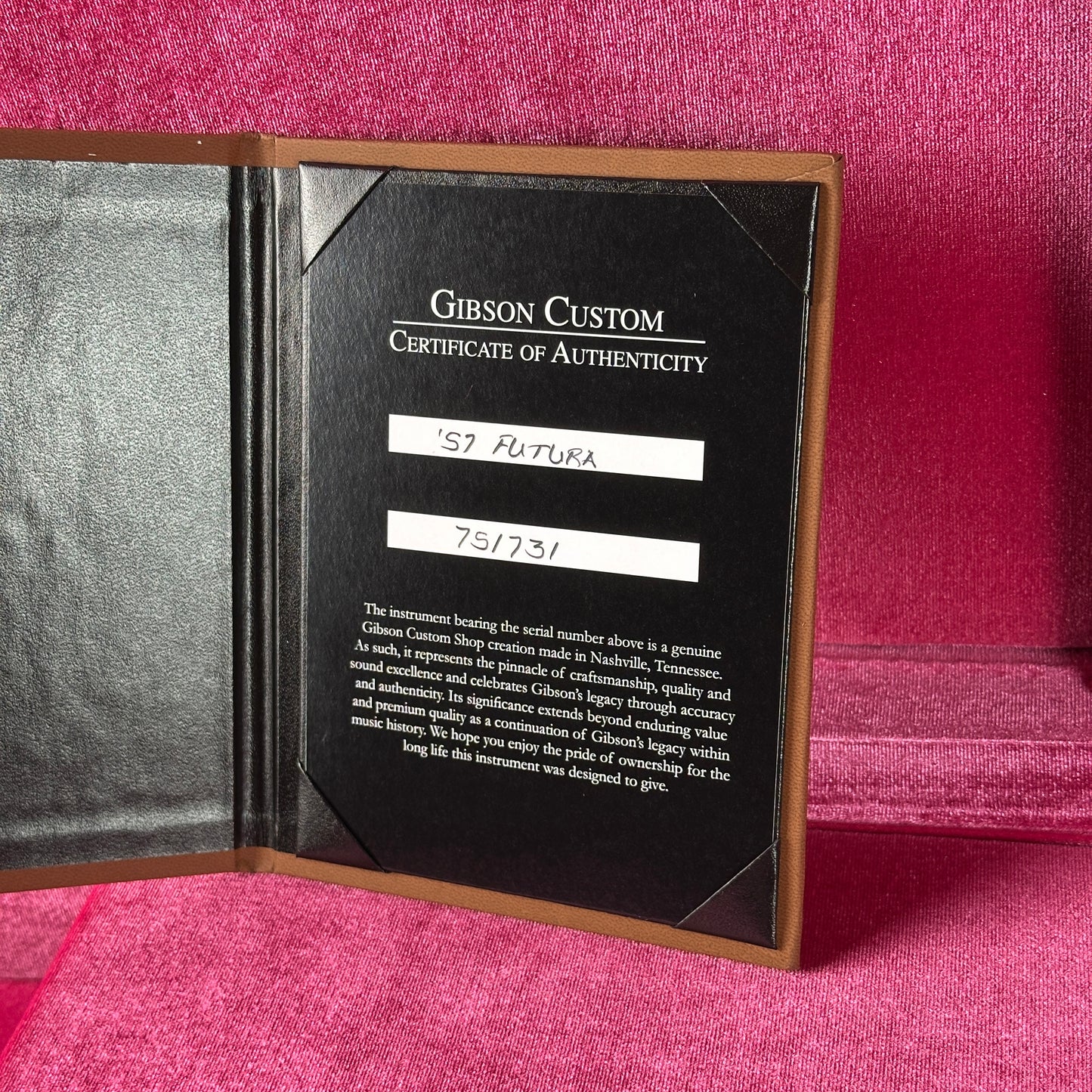 Gibson Custom Certificate of Authenticity on a pink textured background