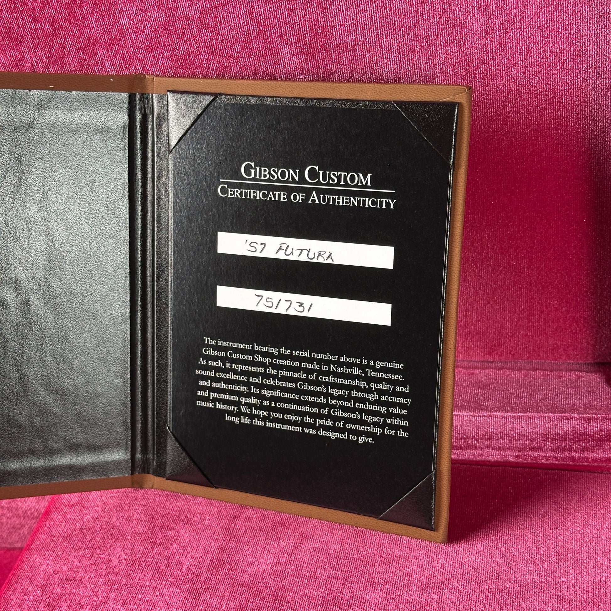 Gibson Custom Certificate of Authenticity on a pink textured background